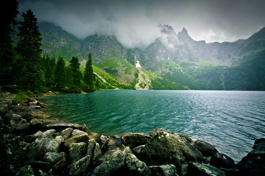 Lake in mountains. Fantasy and colorfull nature landscape. Morskie Oko lake.