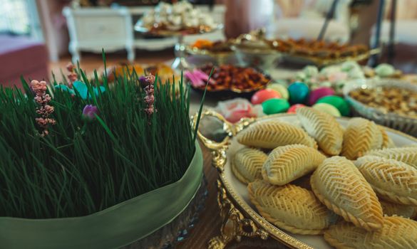 Traditional Azerbaijan holiday Nowruz cookies, baklava, other sweets on the table for celebration.