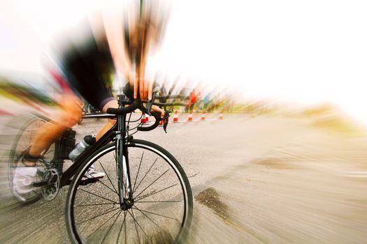 Man on a bicycle at a cycling competition. Motion blur sport image.