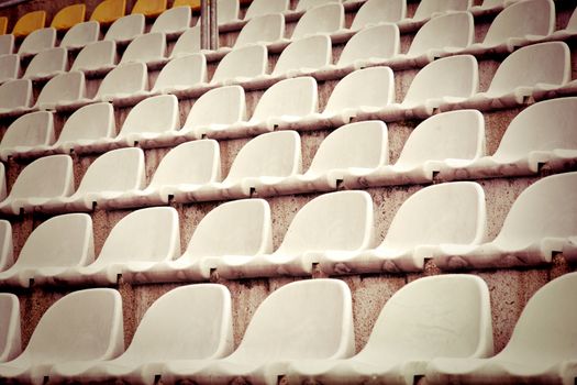 Seats in the stadium stands. Football and sport concept.