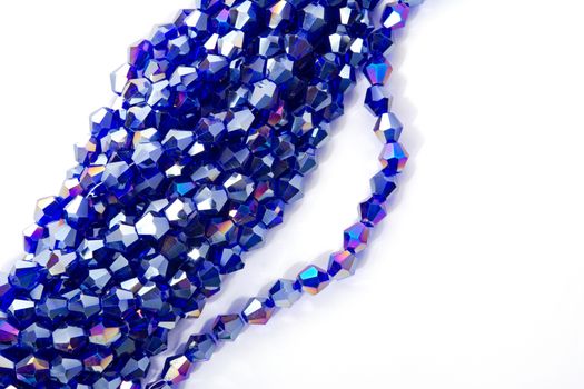 Beautiful Light Blue Glass Sparkle Crystal Isoalted Beads on white background. Use for diy beaded jewelry