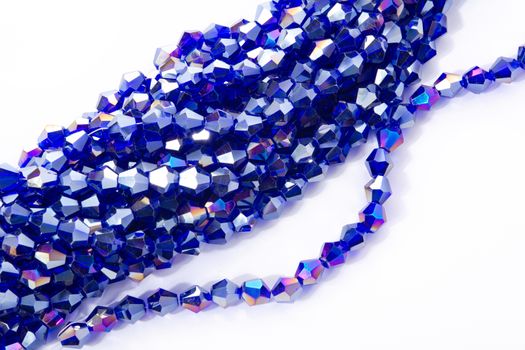 Beautiful Light Blue Glass Sparkle Crystal Isoalted Beads on white background. Use for diy beaded jewelry