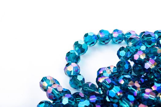 Beautiful Light Blue Glass Sparkle Crystal Isoalted Beads on white background. Use for diy beaded jewelry