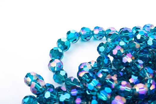 Beautiful Light Blue Glass Sparkle Crystal Isoalted Beads on white background. Use for diy beaded jewelry