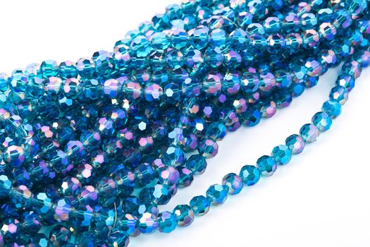 Beautiful Light Blue Glass Sparkle Crystal Isoalted Beads on white background. Use for diy beaded jewelry