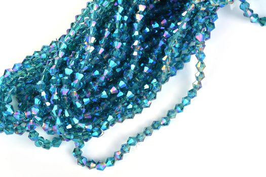 Beautiful Light Blue Glass Sparkle Crystal Isoalted Beads on white background. Use for diy beaded jewelry