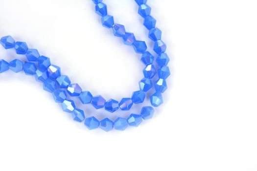 Beautiful Light Blue Glass Sparkle Crystal Isoalted Beads on white background. Use for diy beaded jewelry