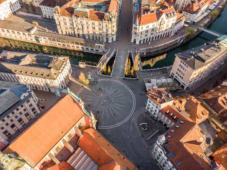 Aerial drone view of Preseren Squere and Triple Bridge over Ljubljanica river,Tromostovje, Ljubljana, Slovenia. Empty streets during corona virus pandemic social distancing measures.