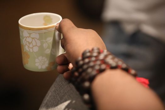 Male hand with cup