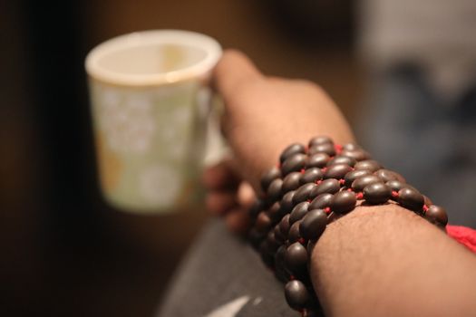 Male hand with cup