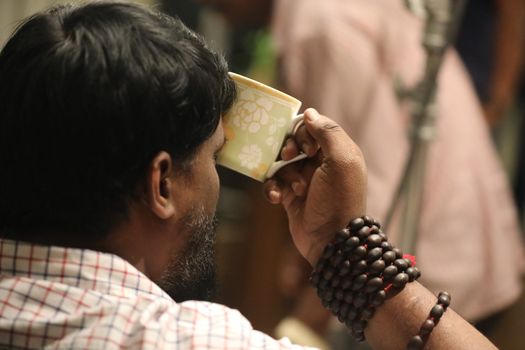 Male hand with cup