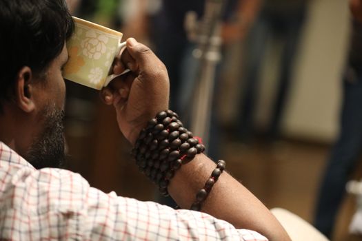 Male hand with cup