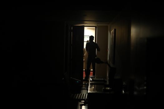 Silhouette of a Female model at door