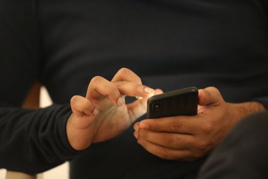 Male Model hands with cell phone