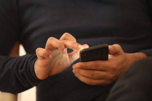 Male Model hands with cell phone