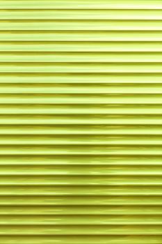 Background and texture of light green metallic blinds in a horizontal line.