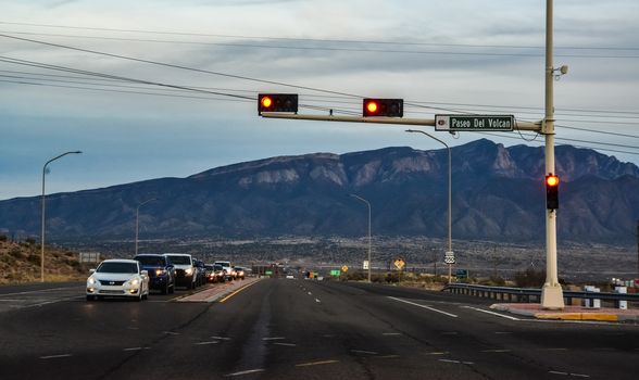 NEW MEXICO, USA - NOVEMBER 19, 2019: Traffic lights against the backdrop of mountains in New Mexico, USA