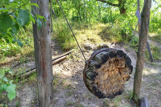 Old Ukrainian Cossack wooden shell on a hill in the middle of the forest, which served as training equipment for throwing knives, axes and arrows.
