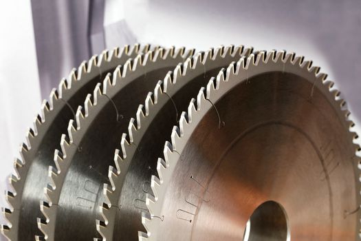 Tool for woodworking, circular saws with carbide brazing for cutting hard wood, close-up, image with copy space.