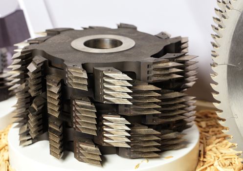 Close-up of stainless steel metal chucks and cutters for cutting wood.