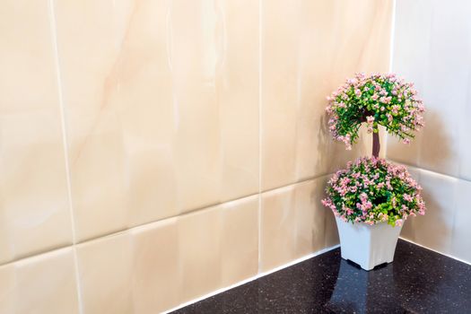 Plastic bouquet in a vase Decorate the wall corner of the wash basin in the shower room