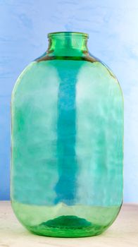 10 liter glass jar of thick green glass, a nice large volume glass container for the practical storage and transportation of any alcoholic and other and liquids.