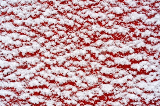 The surface of the white snow. The texture of the snow. Winter background.