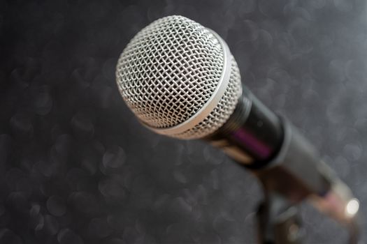 Professional dynamic microphone. Concert microphone for voice recording and sound enhancement. Sound equipment.