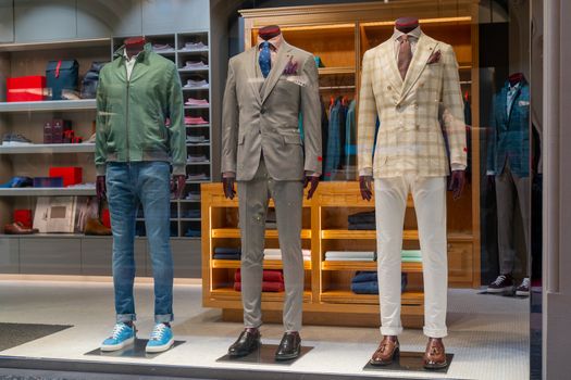 Male dummy in a shop window. Sale of men's clothing.