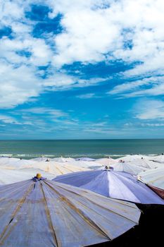 Large umbrella crowded along the beach