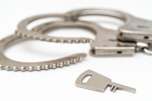 Metal handcuffs. Detention of criminals breaking  law. Restriction of freedom.
