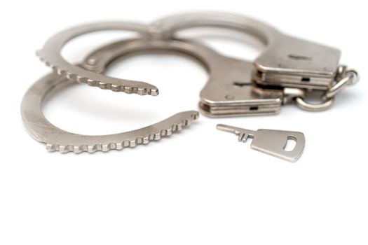 Metal handcuffs. Detention of criminals breaking  law. Restriction of freedom.