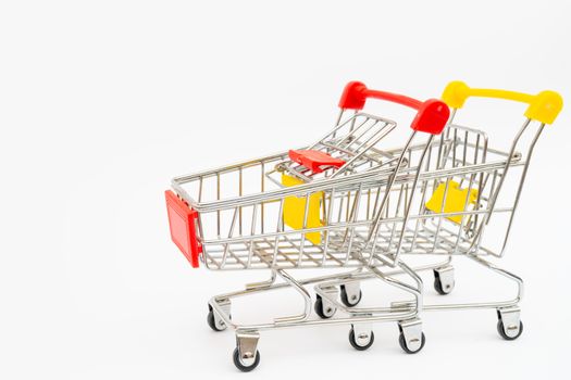 Metal trolley for supermarket. Transportation of products in store. Retail.