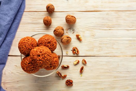 Homemade energy balls with walnuts, peanut, honey and banana. Vegan Vegetarian Raw Snacks. Healthy Sweet Food. Copy space. Flat lay, top view.