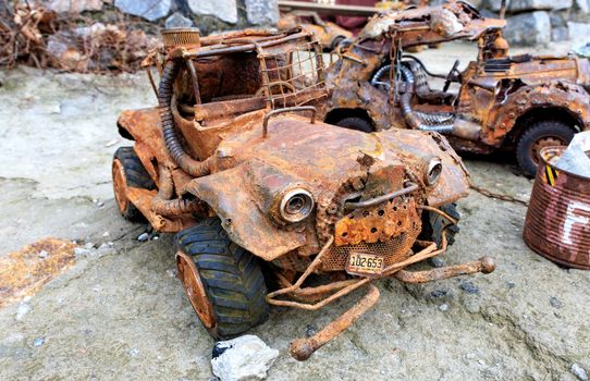 Invented retro style metal toy car made from household waste.