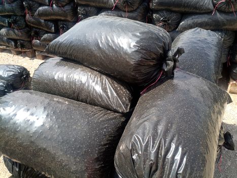 Packages with rubble and sand on the construction site. Building materials base.