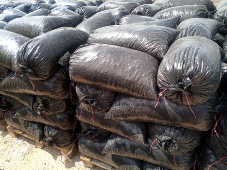 Packages with rubble and sand on the construction site. Building materials base.