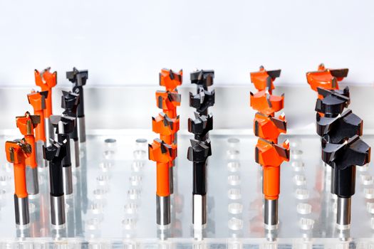 Metal cutters of different diameters for woodcarving, close-up, side view, copy space.