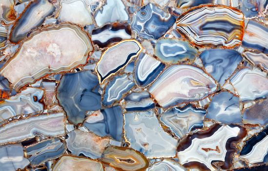 Amazing mesmerizing cross-sectional view gemstones white blue Agate Crystal. Natural agate crystal surface, mineral stone macro closeup.