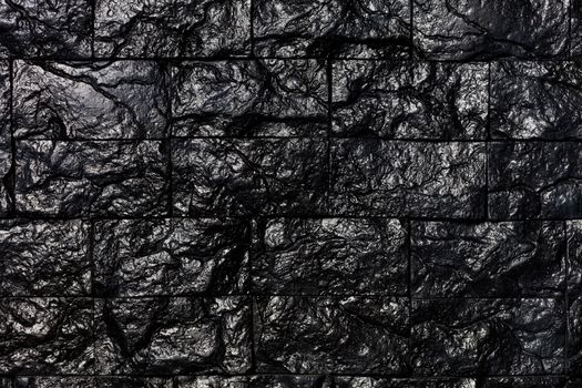 Unusual decorative tiles lined with textured rectangles for the texture and background of black coal.