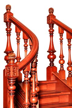 Fragment beautiful of a wooden staircase with figured carved curved balusters and railings and tinted mahogany, isolated on a white background.