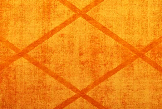 The texture of the textile cotton fabric and the surface is bright orange with a symmetrical rhombic pattern.