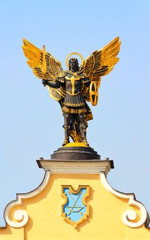 Monument to St. Archangel Michael, the heavenly protector of the city in Kyiv. St. Michael is depicted on the Independence Square with a sword, shield and angel wings against a blue sky. March 29, 2020.