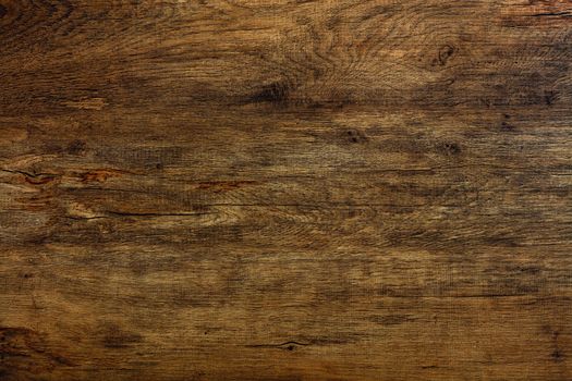 A beautiful pattern of old wood fibers oak with cracks, spots with horizontal waveforms.