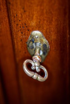 HINGE WITH ANCIENT KEY OF WALNUT FURNITURE SELECTIVE FOCUS