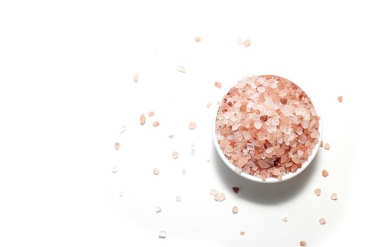 Himalayan pink salt in bowl on table background