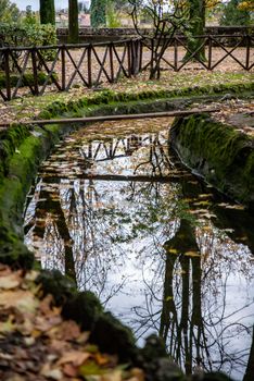 reflections on the pond of the promenade in terni