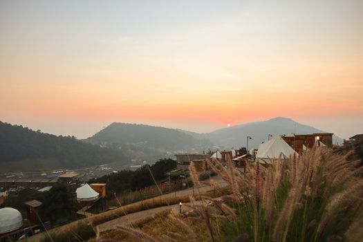 Colorful sunset over the mountain hills in a thai village near mountains in Chiang Mai, Thailand. The mountain scenery view