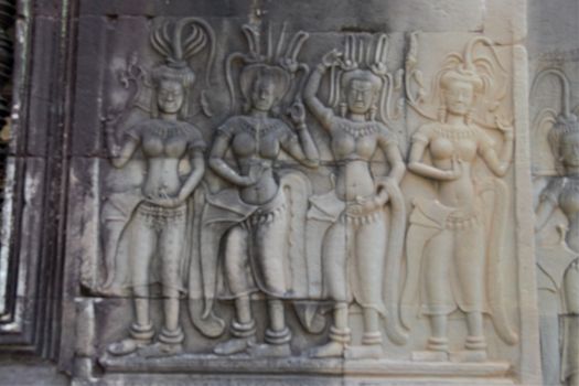 Apsara dancer girl dancing carving in stone at angkor wat temple cambodia siem reap siam