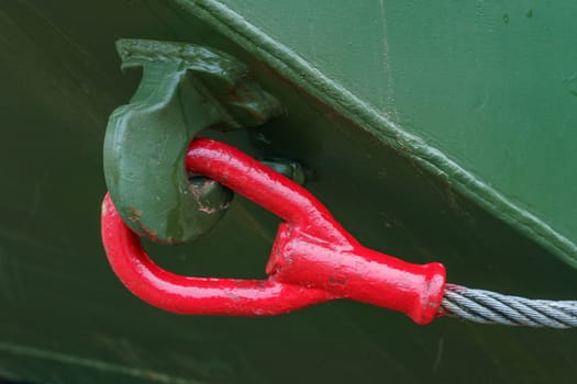 red cable end for towing military equipment mounted on a car